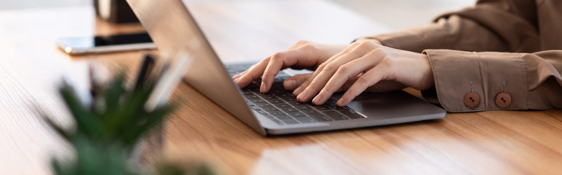 Information Searching. European girl using laptop, close up of female hands, free space